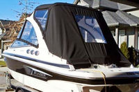 Photo of Larson LXI 238, 2010: With Arch Bimini Connector, Side Curtains, Camper Camper Side and Aft Curtains, viewed from Port Rear 