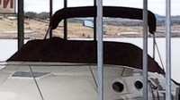 Photo of Regal Commodore 256, 1995: Bimini Top in Boot, Cockpit Cover, viewed from Port Front 