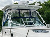 Photo of Robalo 305WA, 2016: Hard-Top, Front Connector, Side Curtains, viewed from Starboard Front 