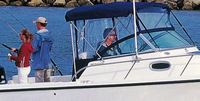 Photo of Boston Whaler Conquest 205, 2008: Bimini Top, Front Visor, Side Curtains, Aft-Drop-Curtain (Factory OEM website photo), viewed from Starboard Side 