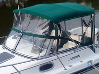 Photo of Boston Whaler Conquest 21 1998: Factory Bimini Top, Front Visor, Side and Aft Curtains, viewed from Port Front 