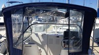 Photo of Boston Whaler Conquest 21, 2000: Factory Bimini Top, Front Visor, Side and Aft Curtains, Inside 