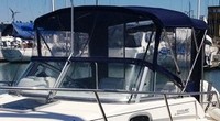 Photo of Boston Whaler Conquest 21, 2000: Factory Bimini Top, Front Visor, Side and Aft Curtains, viewed from Port Front 