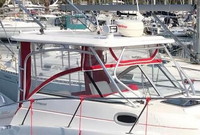 Photo of Boston Whaler Conquest 255, 2002: Hard-Top, Visor and Side Curtains Jockey Red, viewed from Starboard Front 
