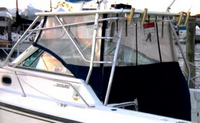 Photo of Boston Whaler Conquest 28 2001: Hard-Top, Front Visor, Side Curtains, Aft-Drop-Curtain, viewed from Port Rear 