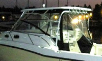 Photo of Boston Whaler Conquest 305, 2005: Hard-Top, Front Connector, Side Curtains, Aft-Drop-Curtain Zipped Open, viewed from Port Side 