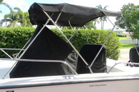 Photo of Boston Whaler Dauntless 200, 2008: Bimini Top Console-Cover Reversible Pilot Seat Cover, viewed from Port Side 