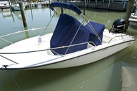 Photo of Boston Whaler Dauntless 200, 2013: Reversible Pilot Seat Cover Console-Cover Sun Top with Boot (black or blue from Whaler) 