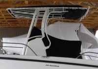 Photo of Boston Whaler Dauntless 210 2015: Factory Canvas T-Top Life Jacket Storage Console Reversible Pilot Seat Cover T-Top, viewed from Port Side 