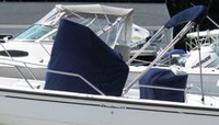 Photo of Boston Whaler Dauntless 22 2000: Bimini Top in Boot Console-Cover Reversible Pilot Seat Cover, viewed from Port Side 