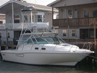 Photo of Boston Whaler Defiance 34, 2000: Hard-Top Enclosure Curtains, viewed from Starboard Front 