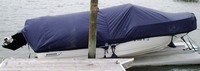 Photo of Boston Whaler Montauk 170 20xx Boat-Cover LCC with Sand Bags on Jet Dock, viewed from Starboard Side 