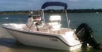 Photo of Boston Whaler Outrage 18, 1999: Bimini Top in Boot, viewed from Port Rear 