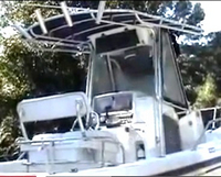 Photo of Boston Whaler Outrage 210 2002: T-Top, Visor T-Top, Side Curtains, viewed from Starboard Rear 