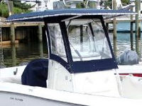 Photo of Boston Whaler Outrage 240 2004: T-Top, Visor, Side Curtains Seat Covers, viewed from Starboard Front 