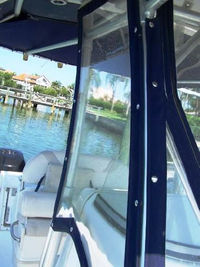 Photo of Boston Whaler Outrage 270 2004: Factory OEM Sunbrella T-Top, Visor T-Top Enclosure Curtains close up, viewed from Starboard 
