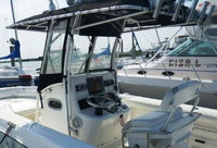 Photo of Boston Whaler Outrage 270, 2006: Factory OEM Sunbrella T-Top, Visor T-Top Enclosure Curtains, viewed from Port Rear 