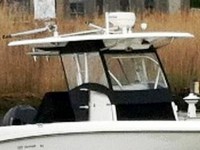 Photo of Boston Whaler Outrage 320 Center Console, 2005: Hard-Top, Visor, Side Curtains, viewed from Starboard Front 