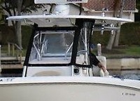 Photo of Boston Whaler Outrage 320 Center Console, 2007: Hard-T-Top, Visor, Side Curtains, viewed from Port Front 