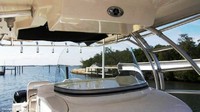 Photo of Boston Whaler Outrage 320 Center Console, 2008: Factory OEM Hard-T-Top Life Jacket Storage 