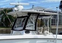 Photo of Boston Whaler Outrage 320 Center Console, 2008: Hard-T-Top Life Jacket Storage Visor, Side Curtains, viewed from Port Front 