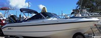 Photo of Boston Whaler Ventura 18 2001: Bimini Top in Boot, Bow Cover Cockpit Cover, viewed from Starboard Front 