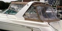 Photo of Formula 41 PC, 2001: Arch Bimini Top, Front Connector, Side Curtains, Camper Top, Camper Side and Aft Curtains, viewed from Port Rear 