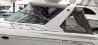 Photo of Formula 41 PC, 2001: Arch Bimini Top, Front Connector, Side Curtains, Camper Top, Camper Side and Aft Curtains, viewed from Port Side 