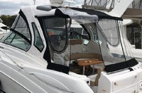 Photo of Four Winns V355 2014: Hard-Top, Arch Visor, Side Curtains, Camper Top, Camper Side and Aft Curtains with Doorway Rolled Open, viewed from Port Rear 