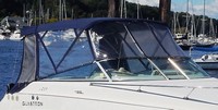 Photo of Glastron GS 259, 2006: No Arch Bimini Top, Front Connector, Side Curtains, Camper Top, Camper Side and Aft Curtains, viewed from Starboard Front 
