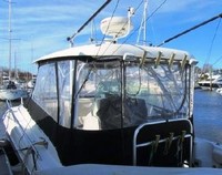 Photo of Hydrasports 3300VX, 2006: Factory Hard-Top, Front Spray-Shield, Side Curtains, Aft Curtain, viewed from Port Rear 
