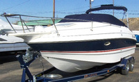 Photo of Larson Cabrio 220, 2005: Bimini Top in Boot, Cockpit Cover, viewed from Port Front 
