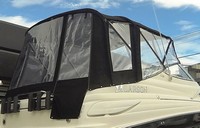 Photo of Larson Cabrio 260 No Arch, 2007: Bimini Top, Side Curtains, Camper Top, Camper Side and Aft Curtains, viewed from Starboard Rear 