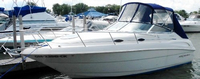 Photo of Monterey 242 Cruiser, 1998: Bimini Top, Front Visor, Side Curtains, Aft Curtain, viewed from Port Front 