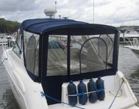 Photo of Monterey 322 Cruiser, 2006: Bimini Top, Side Curtains, Arch-Aft-Top, Camper Top, Camper Side and Aft Curtains, viewed from Port Rear 