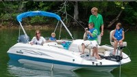 Photo of NauticStar 205 Sport Deck, 2011: Factory Bimini Top in Boot, viewed from Starboard Front (Factory OEM website photo) 