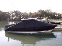 Photo of Pursuit ST 310 Sport 20xx T-Top Boat-Cover in Water, viewed from Starboard Side 
