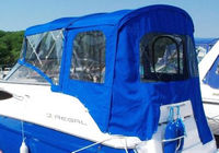 Photo of Regal 2565 Window Express, 2009: Bimini Top, Front Visor, Side Curtains, Camper Top, Camper Side and Aft Curtain Pacific Blue, viewed from Port Rear 