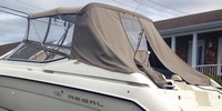 Photo of Regal 2850, 1999: Bimini Top, Front Visor, Side Curtains, Aft Curtain zipped open, viewed from Port Rear 