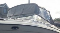 Photo of Regal 2850, 1999: Bimini Top, Front Visor, Side Curtains, viewed from Port Front 