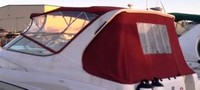 Photo of Regal Commodore 292, 1997: Bimini Top Valance, Front Visor, Side Curtains, Arch Aft Curtain Jockey Red Sunbrella, viewed from Port Rear 