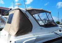 Photo of Regal Commodore 292, 1998: Bimini Top, Front Visor, Side Curtains, Arch Aft Curtain, viewed from Starboard Rear 