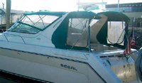 Photo of Regal Commodore 402, 1996: Bimini Top, Front Visor, Side Curtains, Camper Top, Camper Side Curtains, viewed from Port Rear 