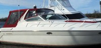 Photo of Regal Commodore 402, 1997: Bimini Top, Front Visor, Side Curtains, Camper Top, Camper Side and Aft Curtains Sunpad Cover, viewed from Starboard Front 