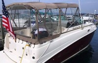 Photo of Rinker 250 Express Cruiser, 2006: Bimini Top, Front Connector, Side Curtains, Camper Top, Camper Side and Aft Curtains, viewed from Starboard Rear 