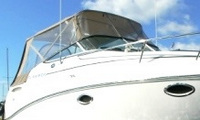 Photo of Rinker 260 Express Cruiser NO Arch, 2008: Bimini Top, Connector, Side Curtains, Aft Curtain, viewed from Starboard Front 