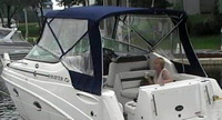 Photo of Rinker 260 Express Cruiser NO Arch, 2008: Bimini Top, Connector, Side Curtains, viewed from Starboard Rear 