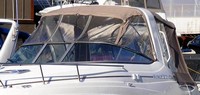 Photo of Rinker 260 Express Cruiser Radar Arch, 2008: Bimini Top, Front Connector, Side Curtains, Camper Top, Camper Side Curtains, viewed from Port Front 