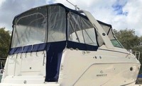 Photo of Rinker 270 Express Cruiser, 2006: Canvas under optional Radar Arch Bimini Top, Connector, Side Curtains, Aft Curtain Camper Top, Camper Side Aft Curtains, viewed from Starboard Rear 
