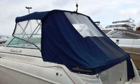 Photo of Rinker 270 Fiesta Vee, 2001: No arch Bimini Top, Connector, Side Curtains, Aft Curtains, viewed from Port Rear 